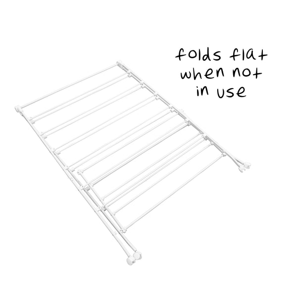 Shelf lifts up and frame folds quickly for narrow, vertical storage